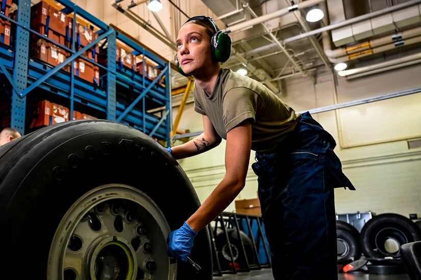 U.S. Air Force Airman First Class Cassandra Herron, 305th Maintenance Squadron crew chief, performs wheel maintenance at Joint Base McGuire-Dix-Lakehurst, N.J. on Aug. 26, 2022. Crew Chiefs in the Wheel and Tire Section of 305 MXS are validating their local ability to breakdown and build-up tire assemblies for the KC-46's main landing gear and nose landing gear. At the beginning of August 2022, the Air Force Life Cycle Management Center authorized Main Operating Bases to stand up organic tire change capability. A four member team consisting of Crew Chiefs, Sheet Metal, and Nondestructive Inspection went to Altus Air Force Base for initial training and familiarization. By validating local ability to breakdown and build-up tire assemblies for the KC-46, the 305th MXS brings a new capability to JB MDL and will be able to improve support for the KC-46 throughout the Air Force. (U.S. Air Force photo by Senior Airman Matt Porter)