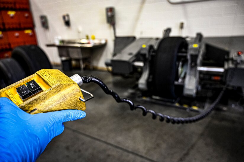 U.S. Air Force Staff. Sgt. Nathan Sturgeon, 305th Maintenance Squadron crew chief, performs wheel maintenance at Joint Base McGuire-Dix-Lakehurst, N.J. on Aug. 26, 2022. Crew Chiefs in the Wheel and Tire Section of 305 MXS are validating their local ability to breakdown and build-up tire assemblies for the KC-46's main landing gear and nose landing gear. At the beginning of August 2022, the Air Force Life Cycle Management Center authorized Main Operating Bases to stand up organic tire change capability. A four member team consisting of Crew Chiefs, Sheet Metal, and Nondestructive Inspection went to Altus Air Force Base for initial training and familiarization. By validating local ability to breakdown and build-up tire assemblies for the KC-46, the 305th MXS brings a new capability to JB MDL and will be able to improve support for the KC-46 throughout the Air Force. (U.S. Air Force photo by Senior Airman Matt Porter)