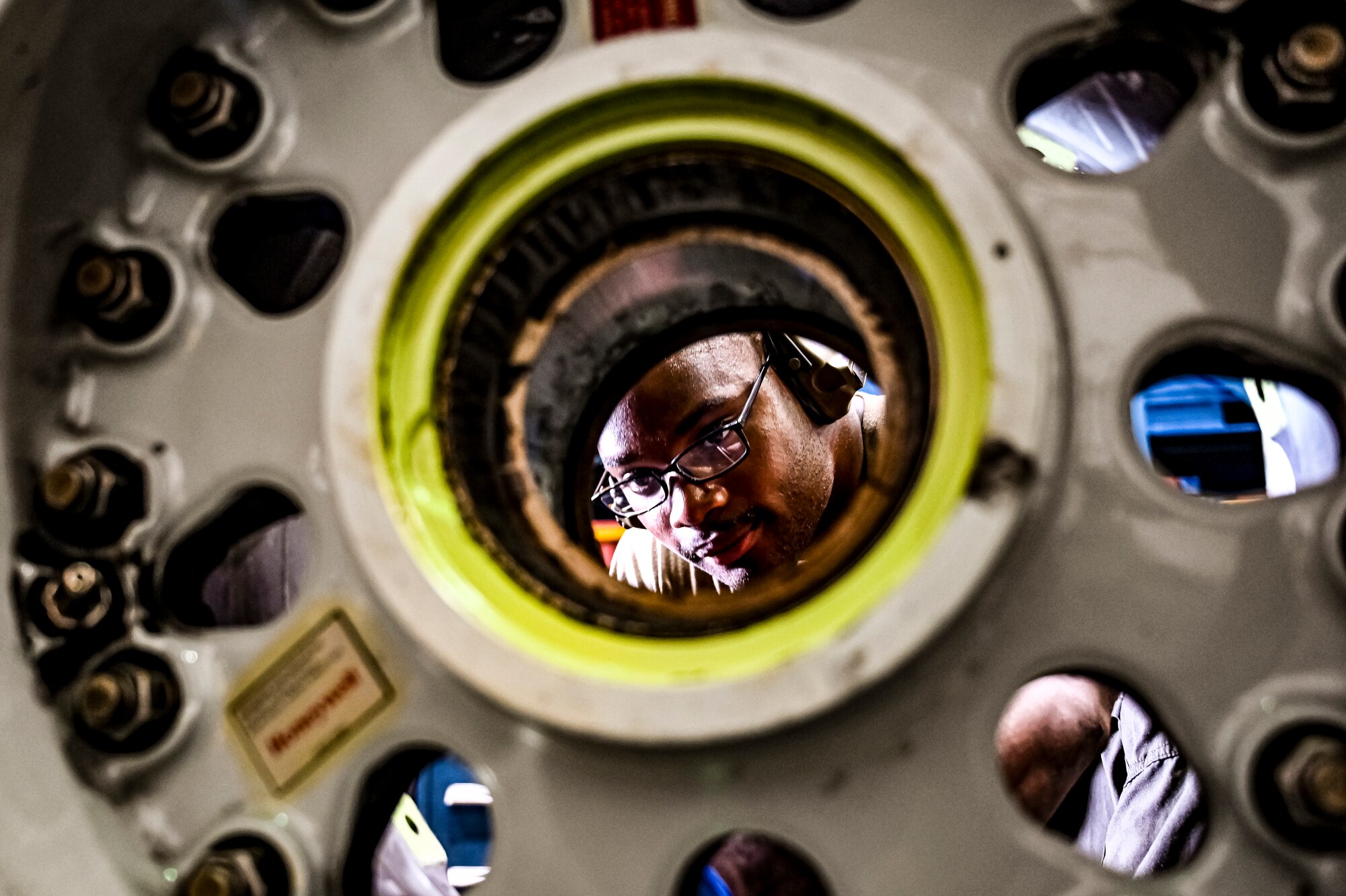 U.S. Air Force Senior Airman Rodney Alston III, 305th Maintenance Squadron crew chief, performs wheel maintenance at Joint Base McGuire-Dix-Lakehurst, N.J. on Aug. 26, 2022. Crew Chiefs in the Wheel and Tire Section of 305 MXS are validating their local ability to breakdown and build-up tire assemblies for the KC-46's main landing gear and nose landing gear. At the beginning of August 2022, the Air Force Life Cycle Management Center authorized Main Operating Bases to stand up organic tire change capability. A four member team consisting of Crew Chiefs, Sheet Metal, and Nondestructive Inspection went to Altus Air Force Base for initial training and familiarization. By validating local ability to breakdown and build-up tire assemblies for the KC-46, the 305th MXS brings a new capability to JB MDL and will be able to improve support for the KC-46 throughout the Air Force. (U.S. Air Force photo by Senior Airman Matt Porter)