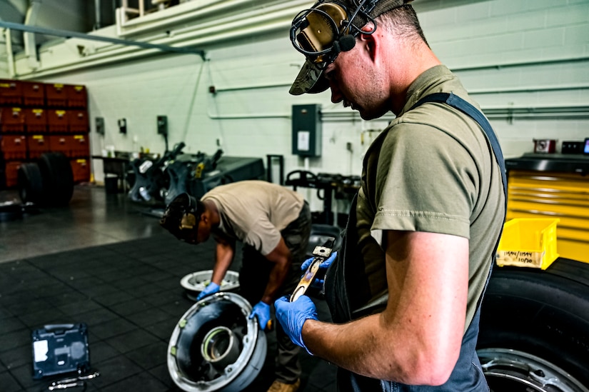 U.S. Air Force Senior Airman Colton Corder, 305th Maintenance Squadron crew chief, performs a wheel inspection at Joint Base McGuire-Dix-Lakehurst, N.J. on Aug. 26, 2022. Crew Chiefs in the Wheel and Tire Section of 305 MXS are validating their local ability to breakdown and build-up tire assemblies for the KC-46's main landing gear and nose landing gear. At the beginning of August 2022, the Air Force Life Cycle Management Center authorized Main Operating Bases to stand up organic tire change capability. A four member team consisting of Crew Chiefs, Sheet Metal, and Nondestructive Inspection went to Altus Air Force Base for initial training and familiarization. By validating local ability to breakdown and build-up tire assemblies for the KC-46, the 305th MXS brings a new capability to JB MDL and will be able to improve support for the KC-46 throughout the Air Force. (U.S. Air Force photo by Senior Airman Matt Porter)