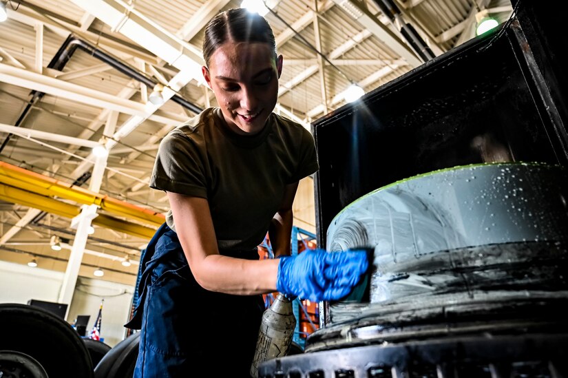 U.S. Air Force Airman First Class Cassandra Herron, 305th Maintenance Squadron crew chief, performs wheel maintenance at Joint Base McGuire-Dix-Lakehurst, N.J. on Aug. 26, 2022. Crew Chiefs in the Wheel and Tire Section of 305 MXS are validating their local ability to breakdown and build-up tire assemblies for the KC-46's main landing gear and nose landing gear. At the beginning of August 2022, the Air Force Life Cycle Management Center authorized Main Operating Bases to stand up organic tire change capability. A four member team consisting of Crew Chiefs, Sheet Metal, and Nondestructive Inspection went to Altus Air Force Base for initial training and familiarization. By validating local ability to breakdown and build-up tire assemblies for the KC-46, the 305th MXS brings a new capability to JB MDL and will be able to improve support for the KC-46 throughout the Air Force. (U.S. Air Force photo by Senior Airman Matt Porter)