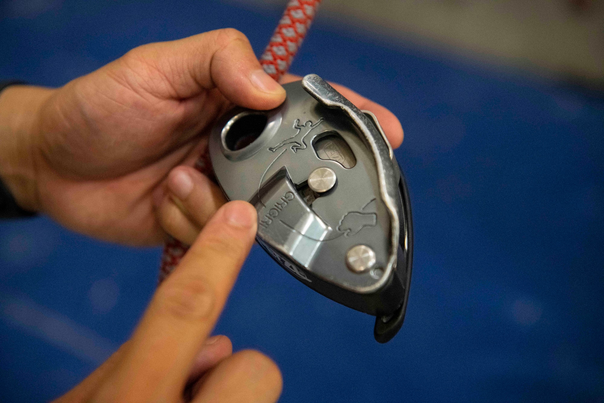A climbing student asks a belay question at Kunsan Air Base, Republic of Korea, Aug. 23, 2022. Approximately 30 personnel regularly climb to relax from work and keep themselves fit to fight. (U.S. Air Force photo by Staff Sgt. Sadie Colbert)