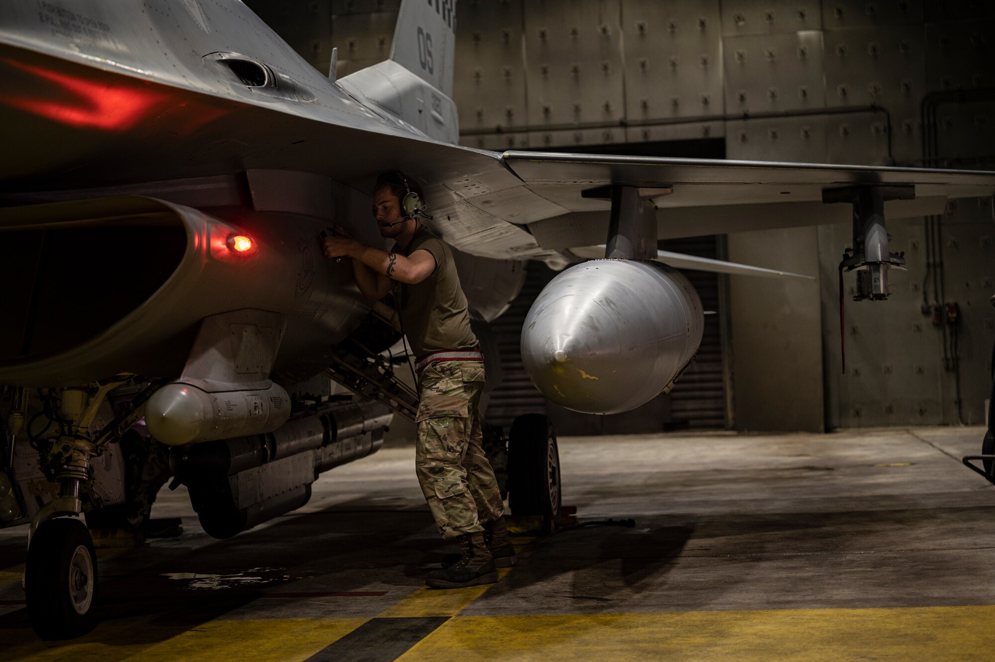 Airman 1st Class Jack Acritell, 36th Fighter Generation Squadron crew chief, performs pre-flight checks on an F-16 Fighting Falcon during a training event at Osan Air Base, Republic of Korea, Aug. 15, 2022.