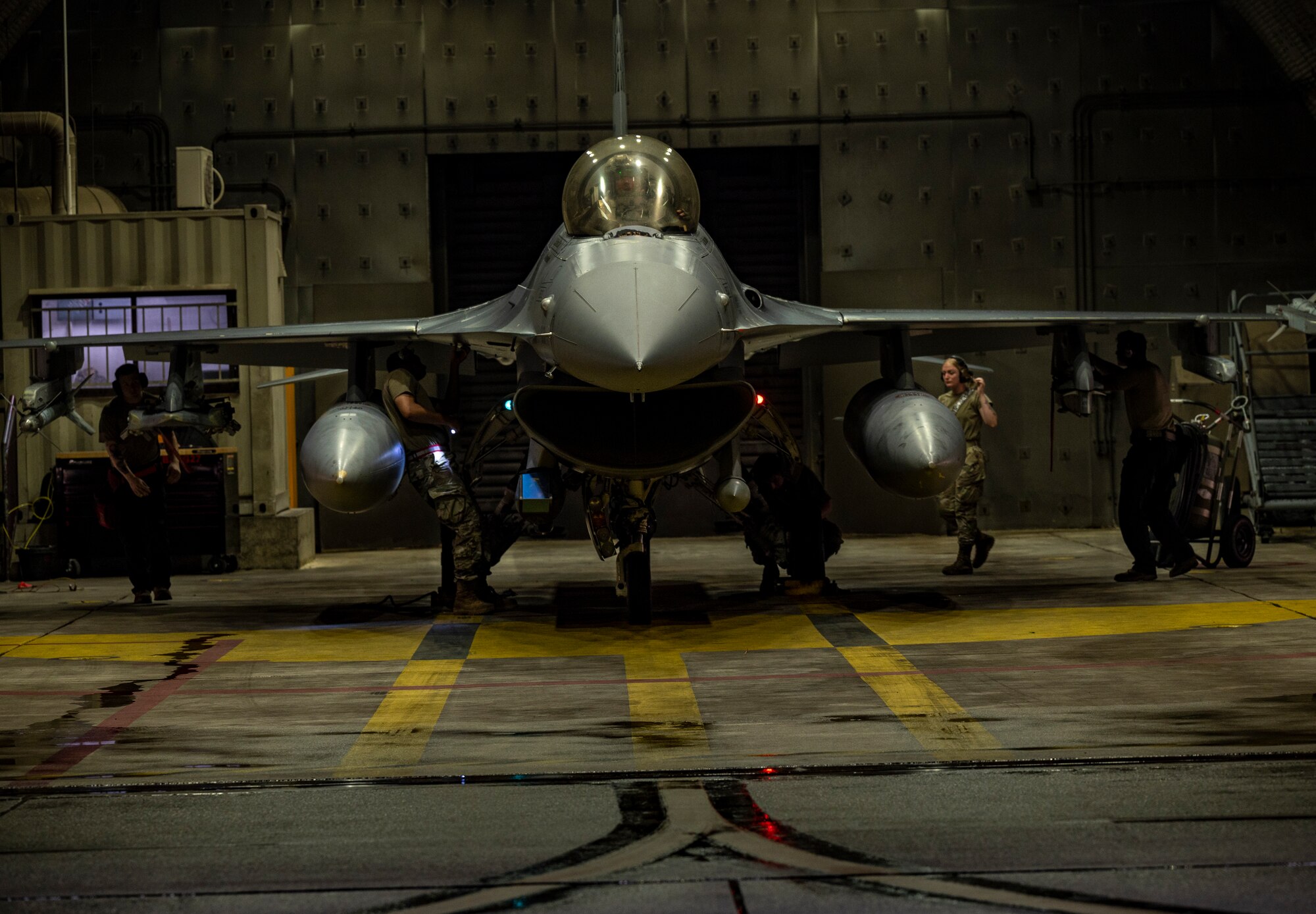 Maintainers assigned to the 36th Fighter Generation Squadron perform pre-flight checks on an F-16 Fighting Falcon during a base-wide training event at Osan Air Base, Republic of Korea, Aug. 15, 2022.