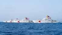 From the left, U.S. Coast Guard fast response cutters USCGC Glen Harris (WPC 1144), USCGC John Scheuerman (WPC 1146), USCGC Emlen Tunnell (WPC 1145) and USCGC Clarence Sutphin Jr. (WPC 1147) transit the Strait of Hormuz