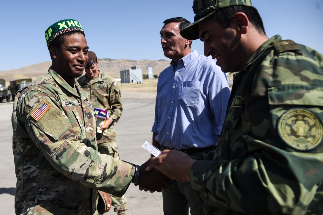 U.S. Soldiers from the Virginia Army National Guard and the 3rd Security Force Assistance Brigade thank troops assigned to the the Tajikistan Ministry of Defense following the field training exercise portion of the exercise “Regional Cooperation 22” Aug. 18, 2022, at a training site near Dushanbe, Tajikistan. RC 22 is an annual, multi-national U.S. Central Command-sponsored exercise conducted by U.S. forces in partnership with Central and South Asia nations. (U.S. Army National Guard photo by Sgt. 1st Class Terra C. Gatti)