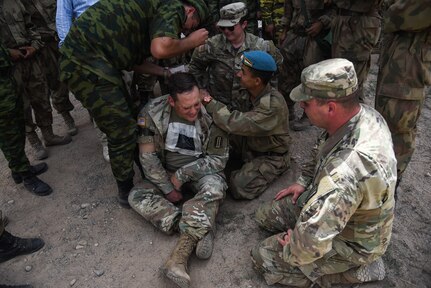 U.S. National Guard Soldiers from Virginia work through medical training lanes alongside their counterparts from the Tajikistan Ministry of Defense during the exercise “Regional Cooperation 22” Aug. 14, 2022, at a training site near Dushanbe, Tajikistan. RC 22 is an annual, multi-national U.S. Central Command-sponsored exercise conducted by U.S. forces in partnership with Central and South Asia nations. (U.S. Army National Guard photo by Sgt. 1st Class Terra C. Gatti)