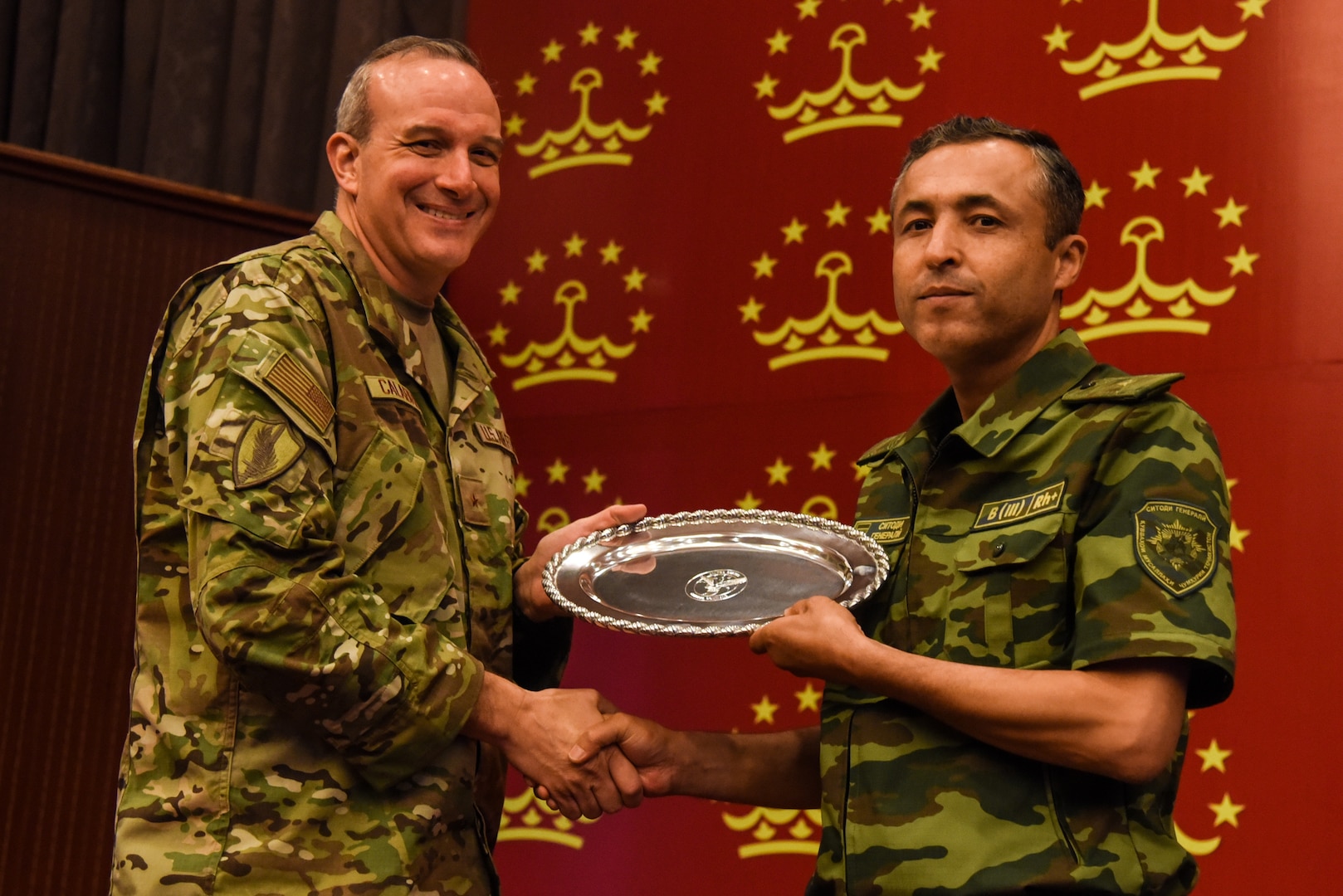 Brig. Gen. Maurizio D. Calabrese, deputy commanding general for intelligence at U.S. Central Command’s Over-the-Horizon Counterterrorism Headquarters, exchanges a gift at the close of the Regional Cooperation 22 exercise in Dushanbe, Tajikistan, Aug. 19, 2022. RC 22 is an annual, multinational U.S. Central Command-sponsored exercise conducted by U.S. forces with Central and South Asia nations.