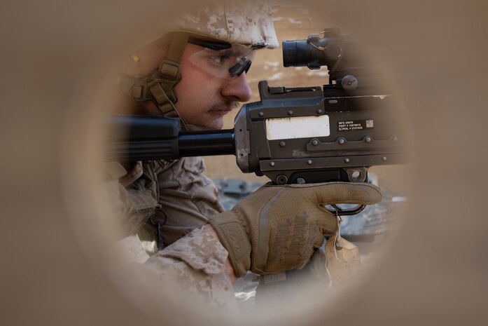 U.S. Marine Corps Lance Cpl. Cody Folcarelli, a motor transport operator with Combat Logistics Regiment 1, 1st Marine Logistics Group, prepares to fire a M240B machine gun during a range shoot during exercise Native Fury 22 at Prince Sultan Air Base, Kingdom of Saudi Arabia, Aug. 17, 2022. The Kingdom of Saudi Arabia's effective capability to provide the access and infrastructure to support Native Fury 22 is a demonstration of our strong interoperability and their enduring commitment to the security and stability of the region. (U.S. Marine Corps photo by Cpl. Casandra Lamas)
