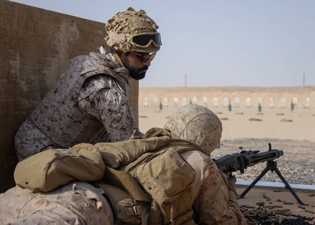 Capt. Abdulrahman ALmushawen, left, assistant commander with Royal Saudi Naval Forces, and U.S. Marine Corps 2nd Lt. Jonathan Spears, logistics officer with 1st Transportation Battalion, Combat Logistics Regiment 1, 1st Marine Logistics Group, prepare to fire during a range shoot during exercise Native Fury 22 at Prince Sultan Air Base, Kingdom of Saudi Arabia, Aug. 17, 2022. The Kingdom of Saudi Arabia's effective capability to provide the access and infrastructure to support Native Fury 22 is a demonstration of our strong interoperability and their enduring commitment to the security and stability of the region. (U.S. Marine Corps photo by Cpl. Casandra Lamas)