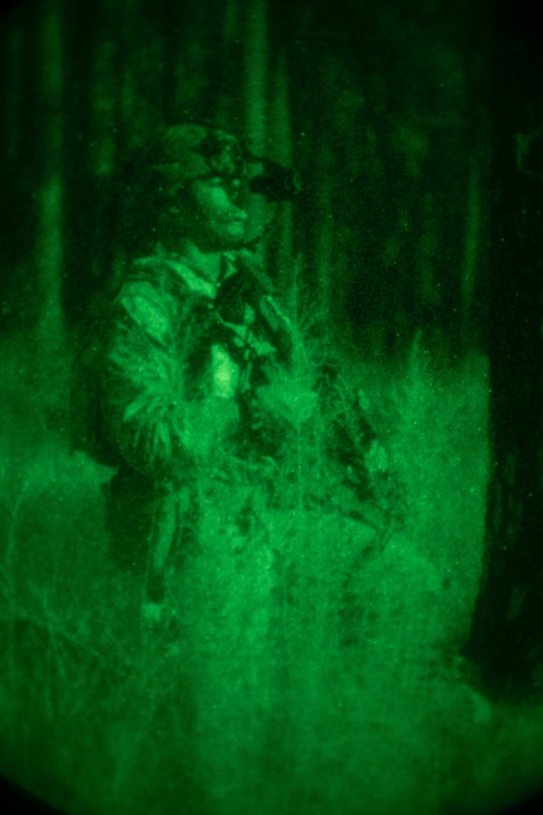 A U.S. Marine with 1st Battalion, 8th Marine Regiment, 2d Marine Division, posts security during Exercise Bold Quest on Fort Stewart, Georgia, Aug. 9, 2022.