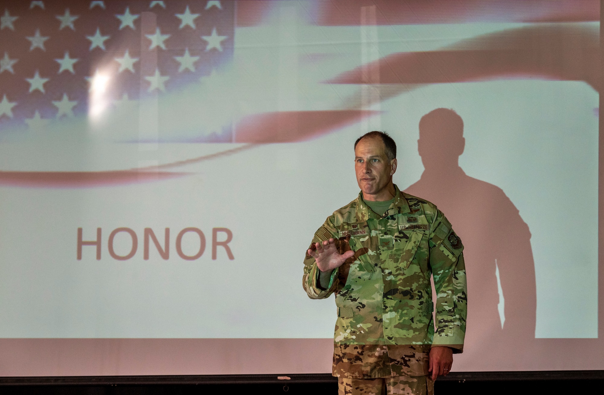 Col. Matt Husemann, 436th Airlift Wing commander, defines honor during a HERO assembly at Welch Elementary School on Dover Air Force Base, Delaware, Aug. 26, 2022. The assembly introduced the school’s new HERO reward system, which encourages students to behave with Honor, Engagement, Responsibility and to include Others. (U.S. Air Force photo by Senior Airman Stephani Barge)