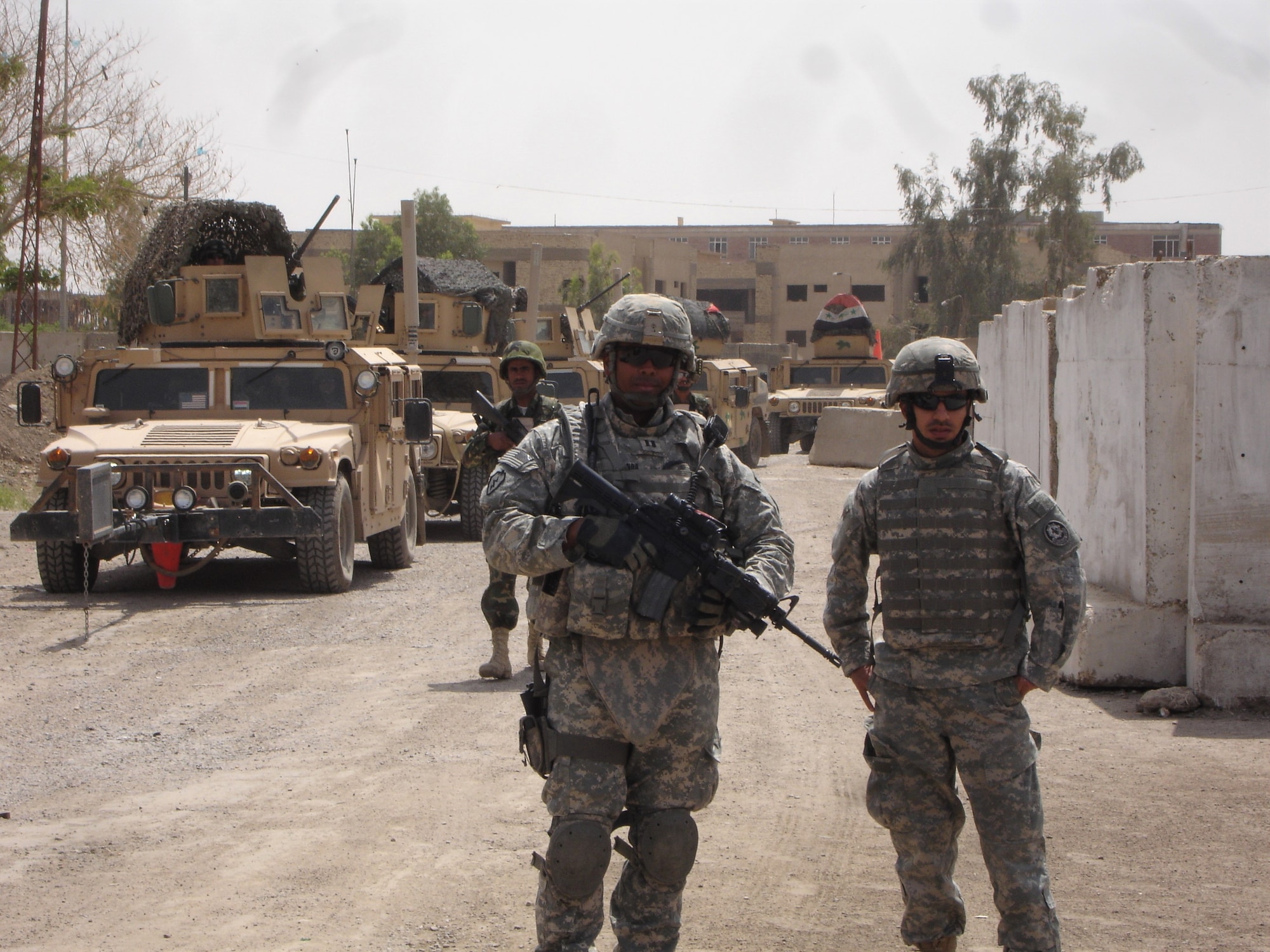 A photo of two men standing.