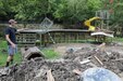 Hall watched rushing flood waters rise and destroy the first story of his house from a hill behind his home which sits about 20 yards from Troublesome Creek.