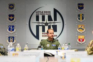 Maj. Gen. Corey Martin sits down during a briefing.