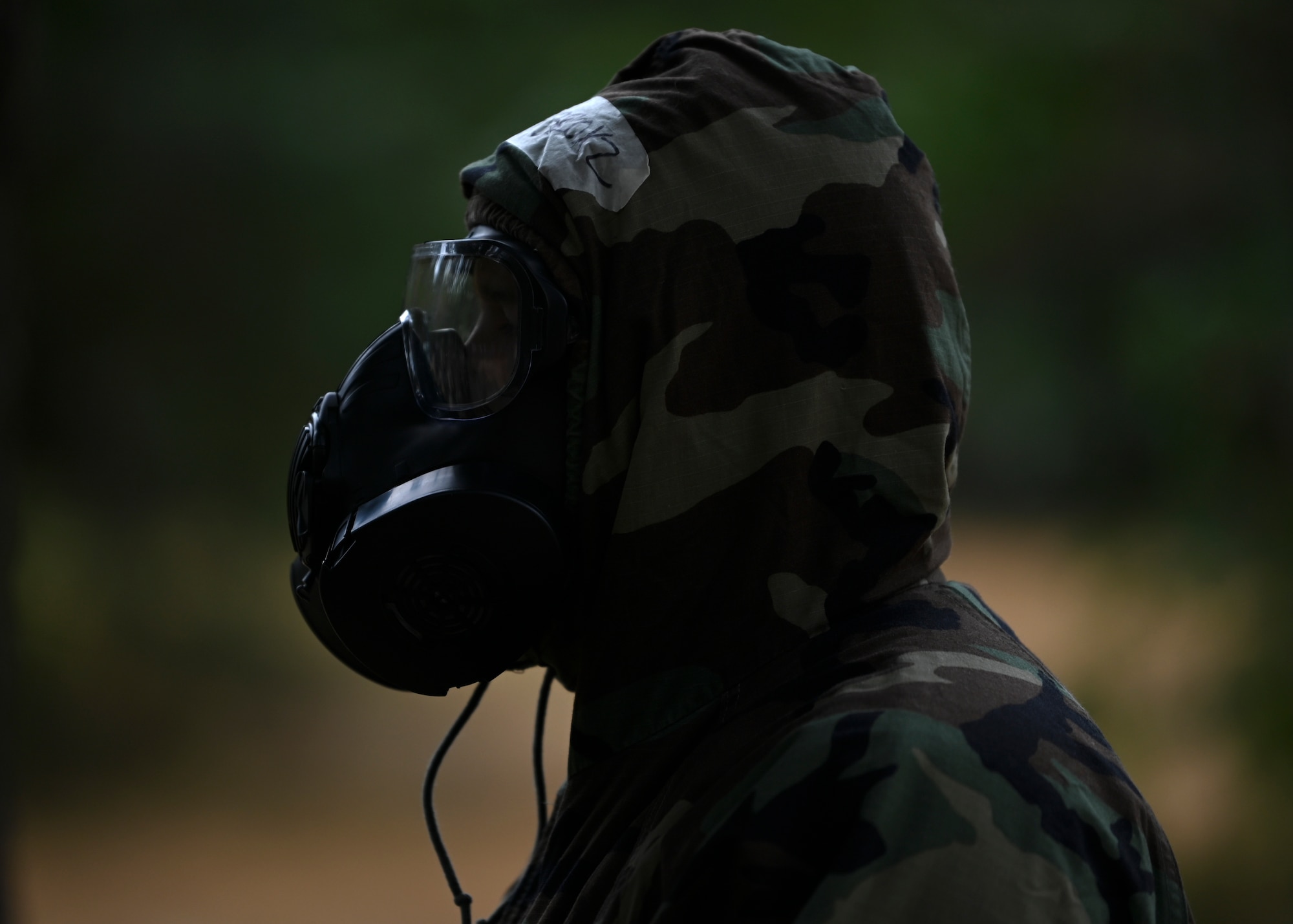 U.S. Air Force Staff Sgt. Michael Blackburn, power production craftsman with the 627th Civil Engineer Squadron, prepares to enter the gas chamber during a joint exercise at Joint Base Lewis-McChord, Washington, Aug. 26, 2022. The 627th CES partnered with the 349th Chemical Company for a chemical, biological, radiological, and nuclear exercise to ensure Airmen are proficient in using a gas mask to prepare them for a biological or chemical attack. (U.S. Air Force photo by Senior Airman Callie Norton)