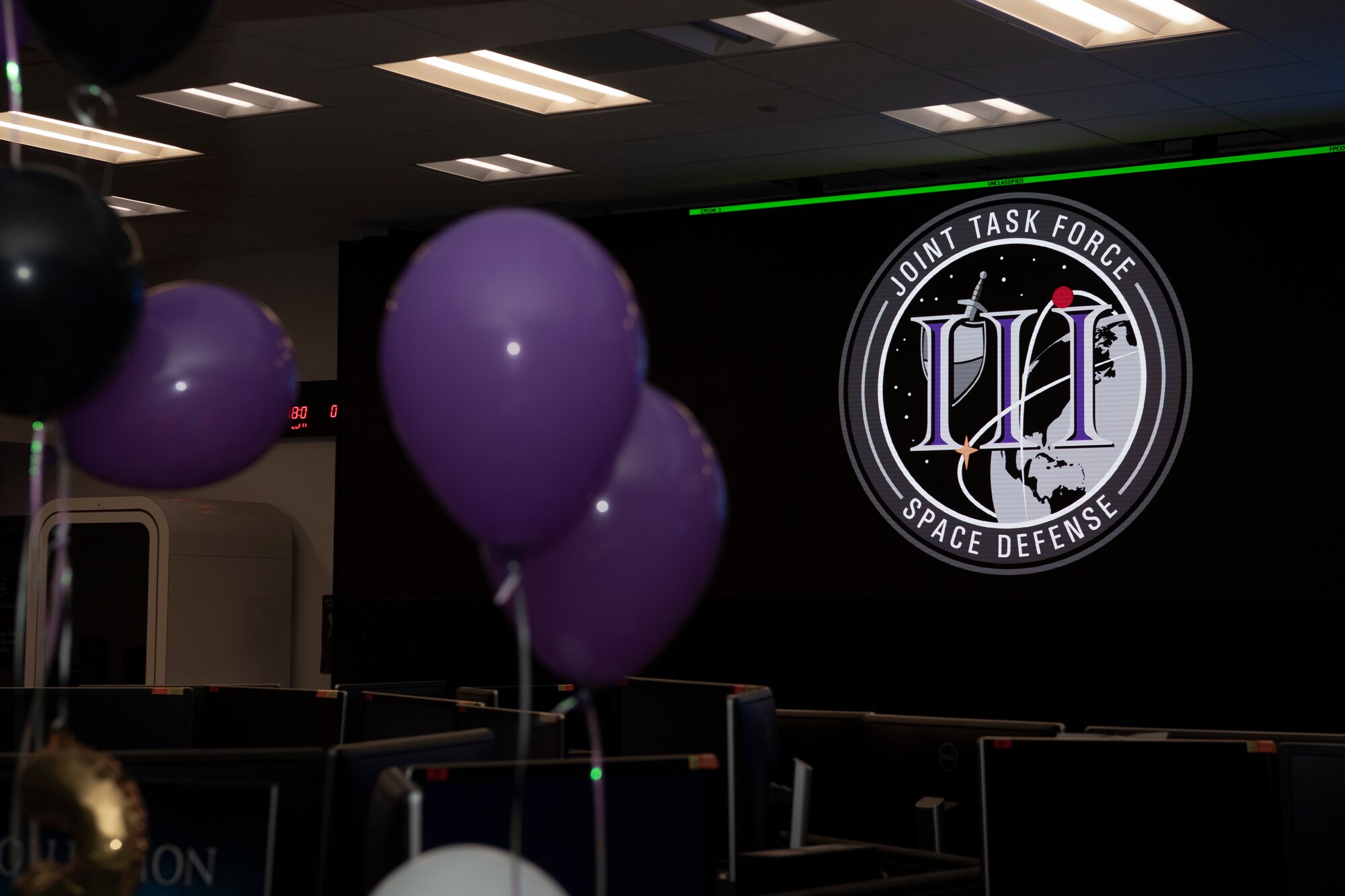 JTF-SD third birthday logo appears on a screen surrounded by purple and black balloons
