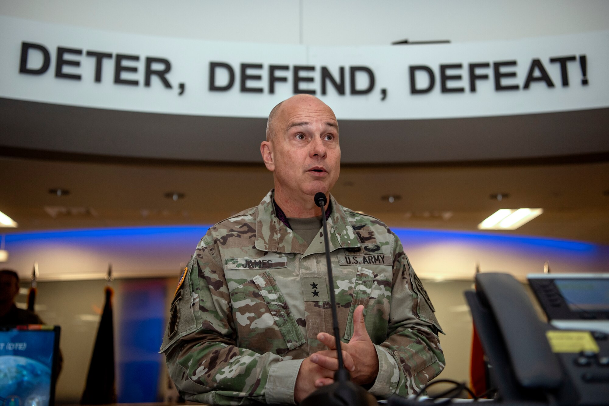 Army general speaking into microphone