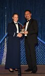 U.S. Air Force Lt. Col. Melissa Runge, U.S. Space Command Surgeon General deputy director, was presented the National Defense Industrial Association Patriot Award by Phillip Wong, NDIA’s Rocky Mountain Chapter president. The award honors service members who have demonstrated “a profound and abiding love of country and whose inspirational leadership, actions, and selfless dedication symbolize our nation’s ideals, values, and founding principles.” (Courtesy Photo)