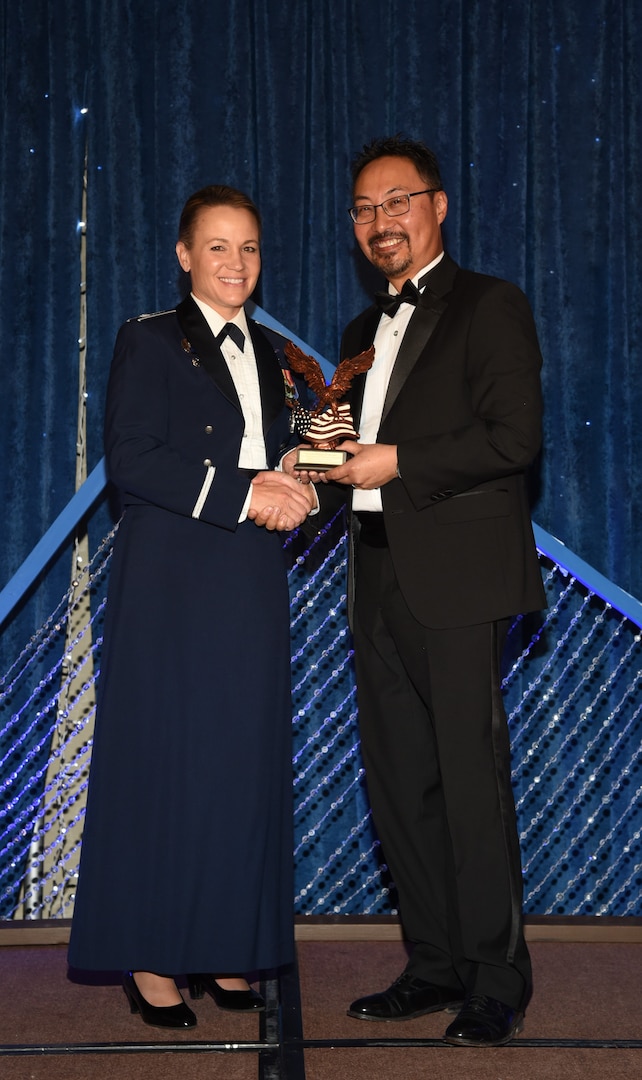 U.S. Air Force Lt. Col. Melissa Runge, U.S. Space Command Surgeon General deputy director, was presented the National Defense Industrial Association Patriot Award by Phillip Wong, NDIA’s Rocky Mountain Chapter president. The award honors service members who have demonstrated “a profound and abiding love of country and whose inspirational leadership, actions, and selfless dedication symbolize our nation’s ideals, values, and founding principles.” (Courtesy Photo)