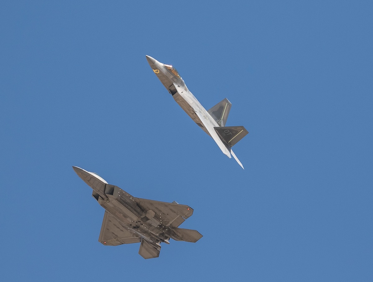 Two F-22 Raptors fly over Edwards Air Force Base, California, Aug. 23, 2022.