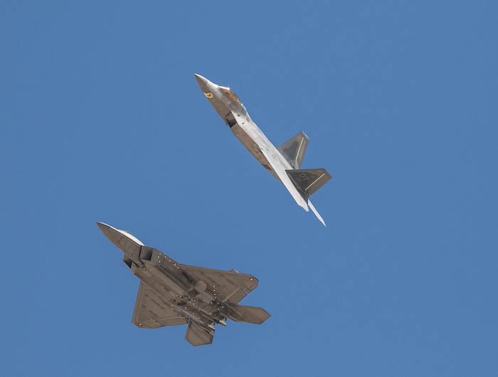 Two F-22 Raptors fly over Edwards Air Force Base, California, Aug. 23, 2022.