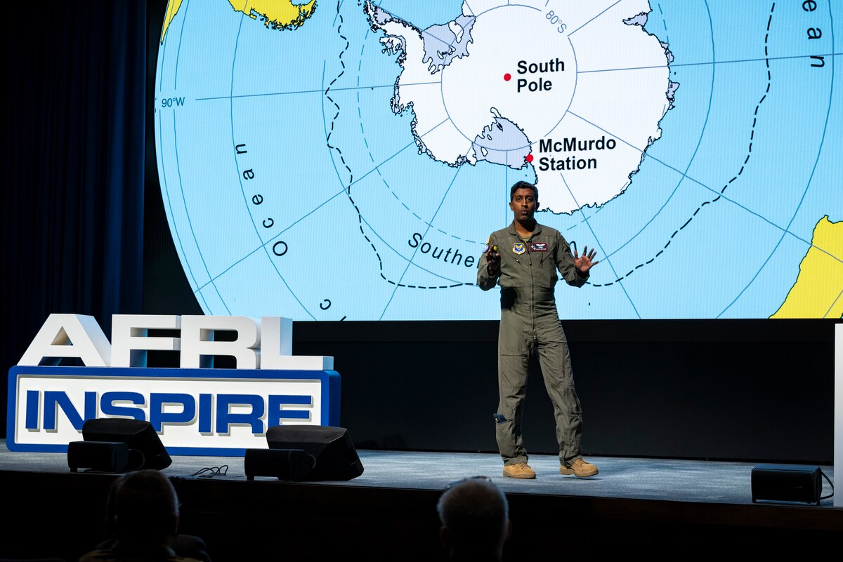 Maj. Michael Nayak, a planetary scientist and Defense Advanced Research Projects Agency program manager; formerly with the Air Force Research Laboratory’s Directed Energy Directorate, presents his talk titled, “Around the World in 80 Steps,” during AFRL Inspire. AFRL hosted this special TEDx-style event at the Air Force Institute of Technology's Kenney Hall at Wright-Patterson Air Force Base, Aug. 23, 2022. (U.S. Air Force photo / Rick Eldridge)