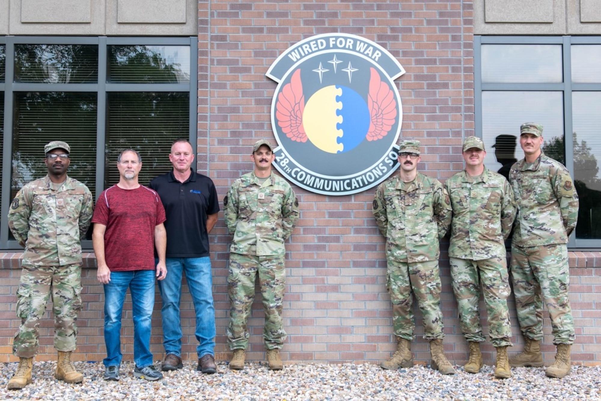 United States Air Force 28th Communications Squadron personnel pose for a group photo at Ellsworth Air Force Base, S.D., Aug. 2, 2022.