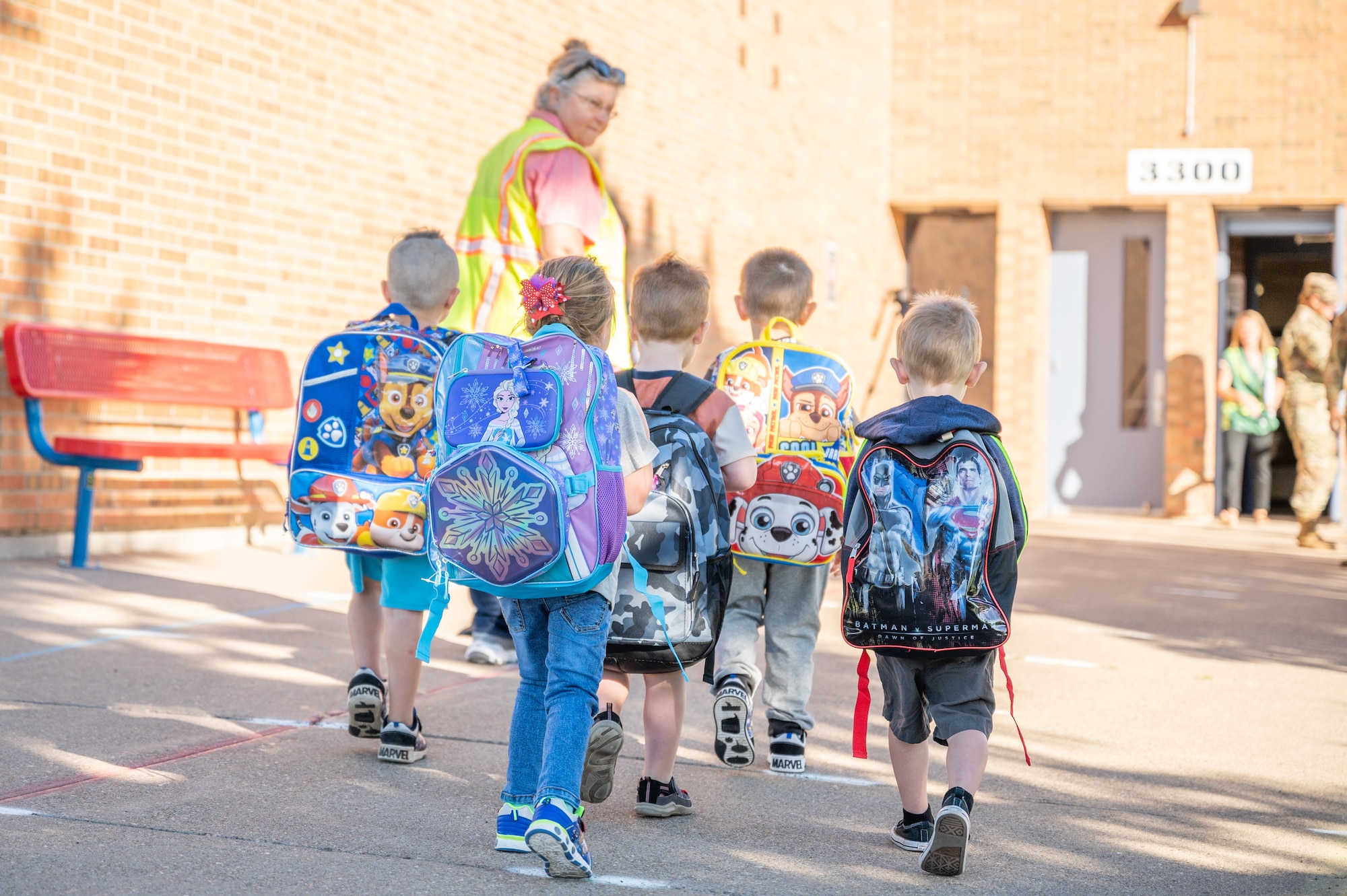 Students and faculty enter the Great Falls Public Schools Early Learning Family Center for the first day of transitional kindergarten Aug. 29, 2022, in Great Falls Mont.