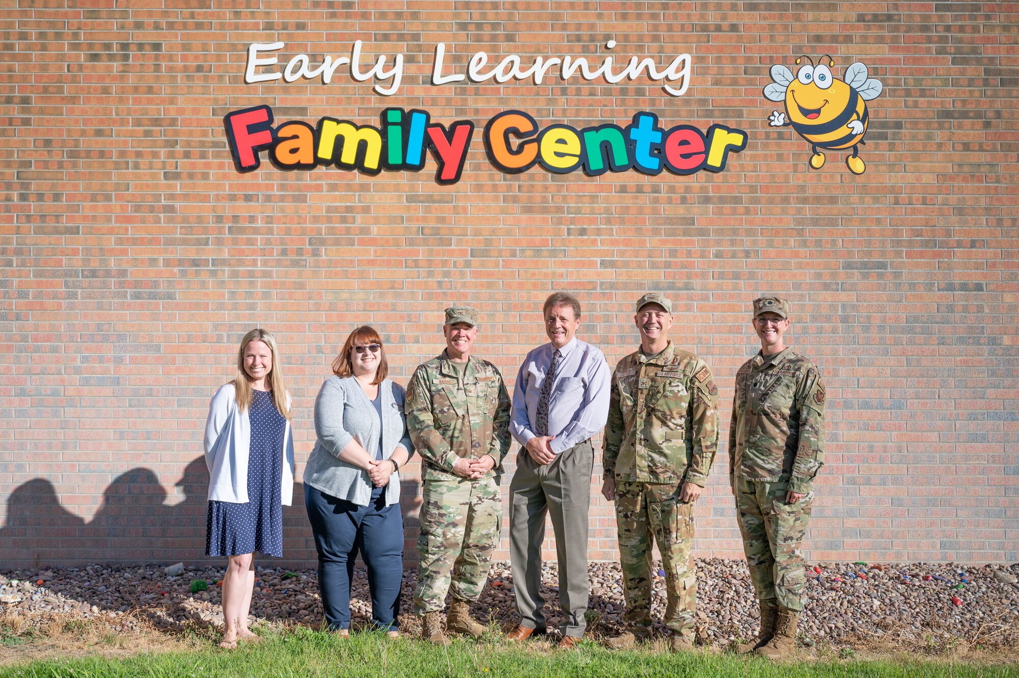 Malmstrom Air Force Base and Great Falls Public Schools leadership pose for a group photo in front of the GFPS Early Learning Family Center Aug. 29, 2022, in Great Falls, Mont.