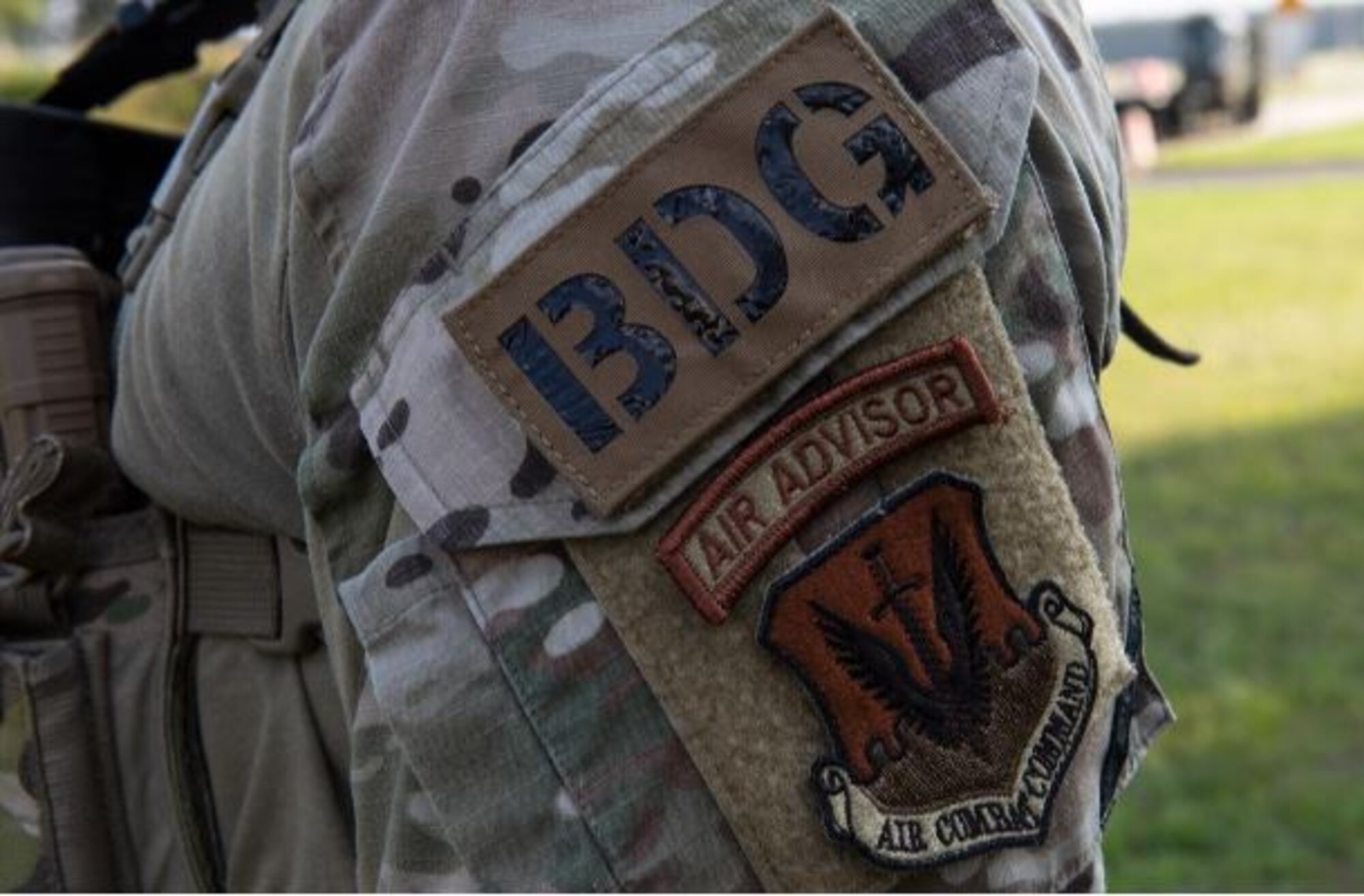 U.S. Air Force Tech. Sergeant Jamian Carrasquillo, 824th Base Defense Squadron squad leader poses with the 820th Base Defense Group patch Aug. 16, 2022 at Łask Air Base, Poland. The 824th BDS is a part of the 820th Base Defense Group based out of Moody Air Base, Georgia. The 824th BDS forward deployed from Ramstein Air Base, Germany to support the 90th Expeditionary Fighter Squadron executing the NATO Air Shielding mission. (U.S. Air Force photo by Staff Sergeant Danielle Sukhlall)