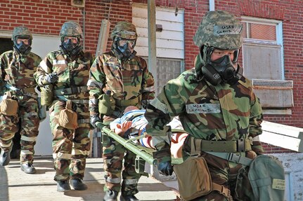 Senior Airmen Kristin Julius and Hector Martinez-Gomez, aerospace medical technicians from the 127th Medical Group, carry a simulated victim during Tactical Combat Casualty Care  training at Selfridge Air National Guard Base, Michigan. The training Aug. 15-16, 2022, was part of August drill.