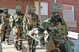 Senior Airmen Kristin Julius and Hector Martinez-Gomez, aerospace medical technicians from the 127th Medical Group, carry a simulated victim during Tactical Combat Casualty Care  training at Selfridge Air National Guard Base, Michigan. The training Aug. 15-16, 2022, was part of August drill.