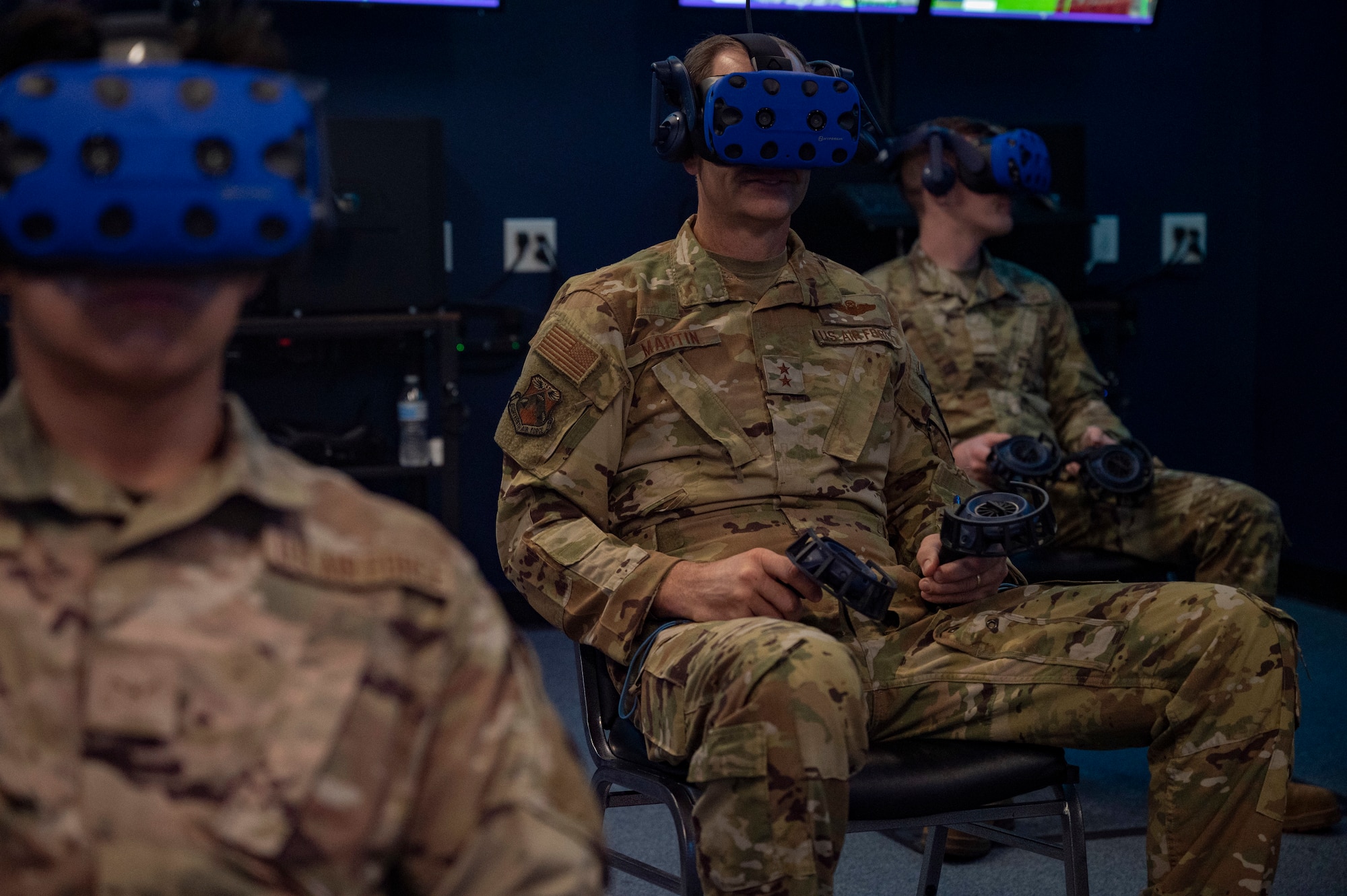 Maj. Gen. Corey Martin, 18th Air Force commander, looks through a virtual reality headset at Dyess Air Force Base, Texas, Aug. 25, 2022. The 317th Maintenance Group VR lab’s vision is to accelerate change in today’s C-130J Super Hercules maintenance training by utilizing 21st century technology, innovation through collaboration with other C-130J professionals, and transforming VR through the creative lens of the Airmen and their feedback. (U.S. Air Force photo by Senior Airman Josiah Brown)