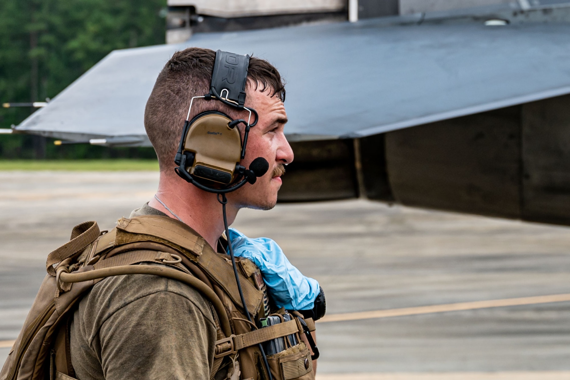 A photo of an Airman next to an F-16 Fighting Falcon.