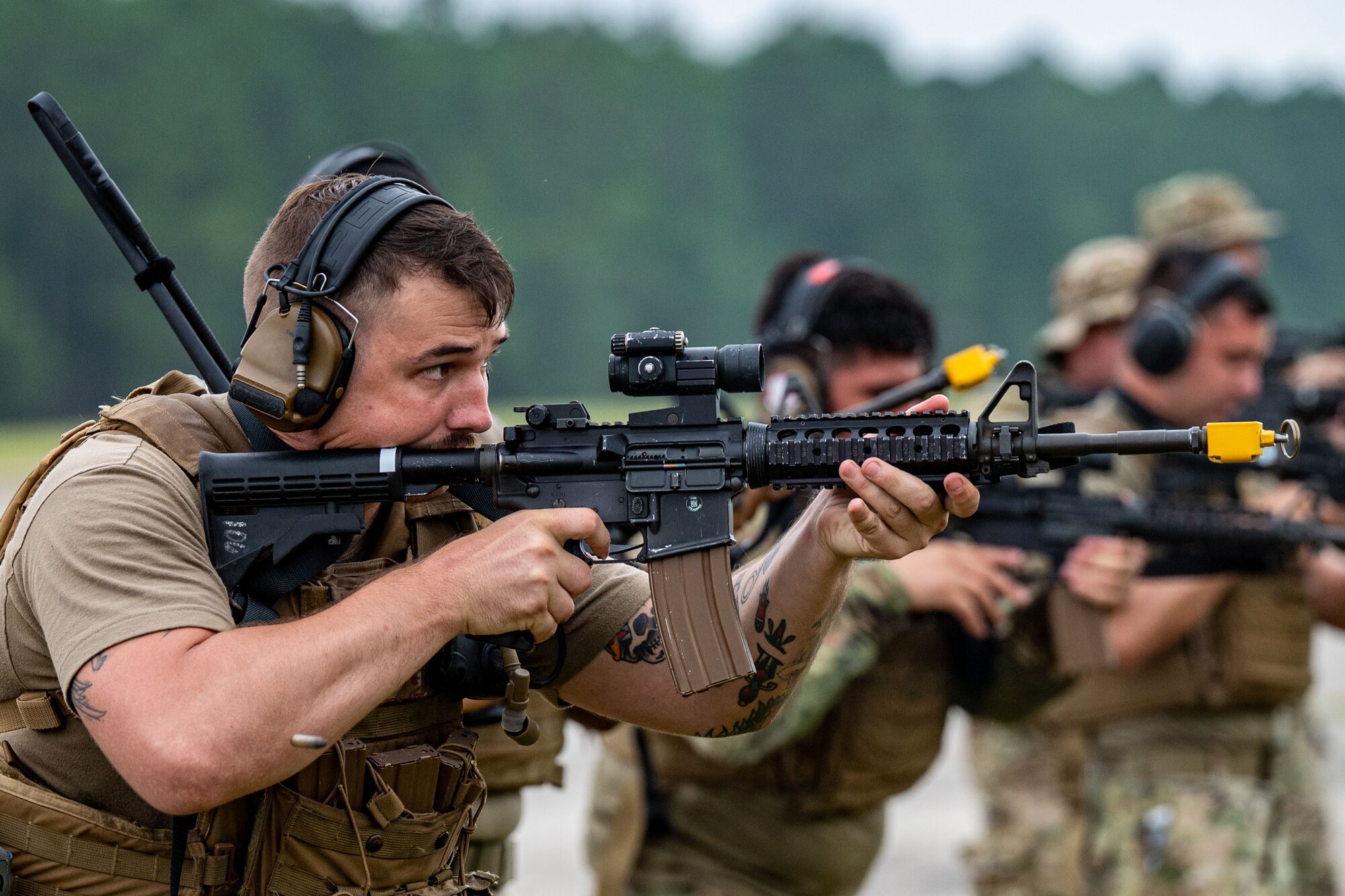 A photo of an Airman with a weapon.