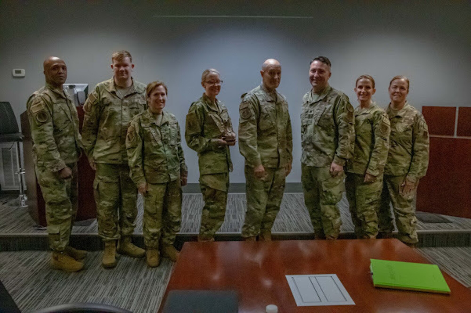 The 125th Fighter Wing JAG office is pictured after accepting the award as the 2021 Legal Office of Year, Aug. 14, 2022 at the Jacksonville Air National Guard Base, Florida. The 125th FW JAG office bested 40 other ANG units across the ACC to win the award. (U.S. Air National Guard photo by Staff Sgt. Cole Benjamin)