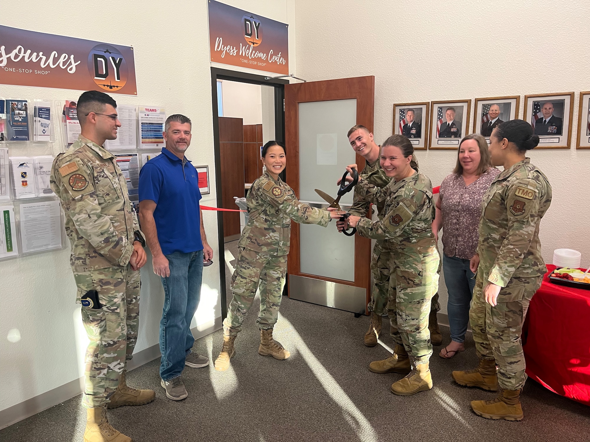 Airmen assigned to the 7th Force Support Squadron cut the ribbon during the grand opening ceremony for the new Dyess Welcome Center at Dyess Air Force Base, Texas, Aug. 29, 2022. The Dyess Welcome Center is located at BLDG 7402 and will be open Monday, Tuesday, and Thursday from 8 a.m.- 4 p.m. or by appointment scheduled by unit support staff. (U.S. Air Force photo by Tech. Sgt. David Scott-Gaughan)