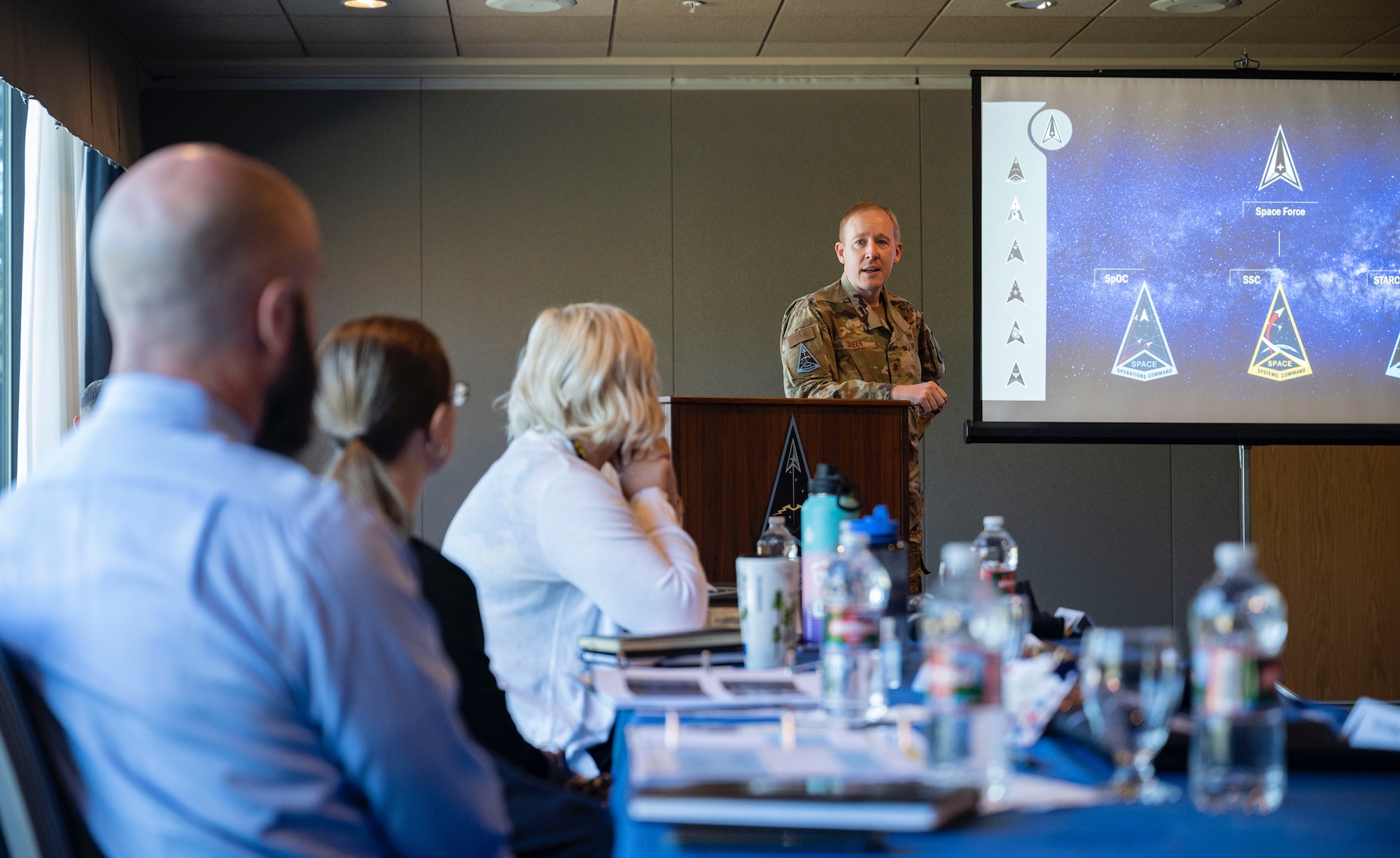 Space Training and Readiness Command spouses receive a mission brief during a conference at the U.S. Air Force Academy,
