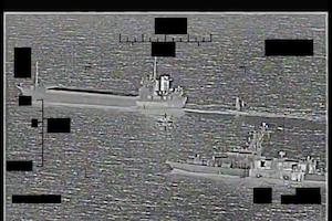 ARABIAN GULF (Aug. 30, 2022) Screenshot of a video showing support ship Shahid Baziar, left, from Iran's Islamic Revolutionary Guard Corps Navy unlawfully towing a Saildrone Explorer unmanned surface vessel in international waters of the Arabian Gulf as U.S. Navy patrol coastal ship USS Thunderbolt (PC 12) approaches in response, Aug. 30.