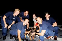 On board CGC MIDGETTE - A photo of the dog "Lai Wong" who was aboard the Chinese Fishing Vessel BANGUN PERKASA that was seized by the crew of CGC MIDGETTE in 2012. Here he is posing with MIDGETTE's AVDET personnel.