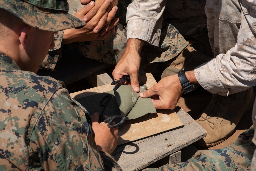 U.S. Marines with 1st Combat Engineer Battalion, 1st Marine Division, cut materials for an advanced demolition range during the Sapper Leaders Course on Marine Corps Base Camp Pendleton, California, Aug. 18, 2022.  The Sapper Leaders Course provides small-unit leaders with the training necessary for independent operation, teaching them how to interpret the operating environment, seize opportunities, and effectively maneuver without direction.