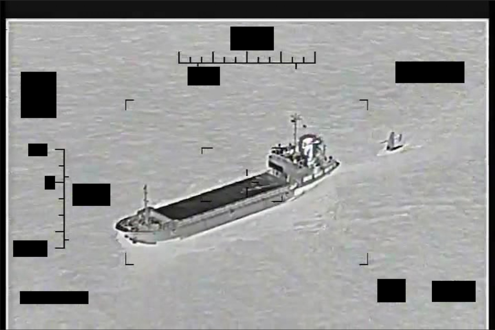ARABIAN GULF (Aug. 30, 2022) Screenshot of a video showing support ship Shahid Baziar, left, from Iran's Islamic Revolutionary Guard Corps Navy unlawfully towing a Saildrone Explorer unmanned surface vessel in international waters of the Arabian Gulf, Aug. 30.