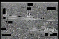 ARABIAN GULF (Aug. 30, 2022) Screenshot of a video showing support ship Shahid Baziar, left, from Iran's Islamic Revolutionary Guard Corps Navy unlawfully towing a Saildrone Explorer unmanned surface vessel in international waters of the Arabian Gulf as U.S. Navy patrol coastal ship USS Thunderbolt (PC 12) approaches in response, Aug. 30.