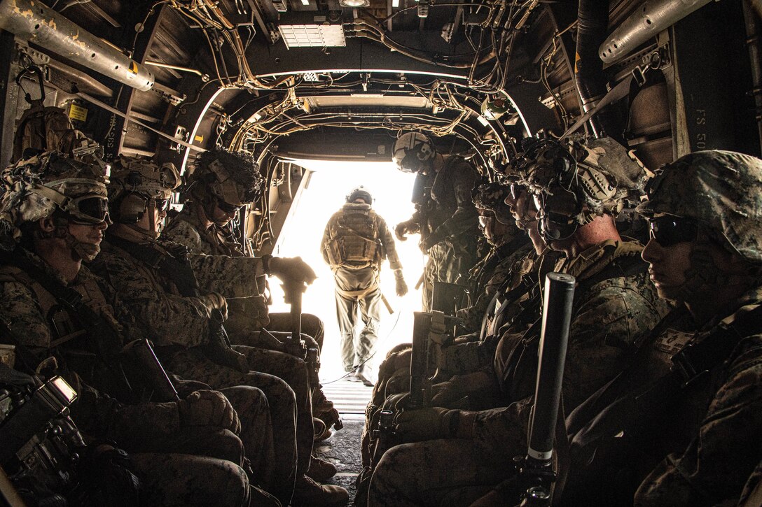 U.S. Marines with Weapons Company, 1st Battalion, 4th Marine Regiment, 1st Marine Division, stand by for take off in an MV-22B Osprey during a Tactical Recovery of Aircraft and Personnel exercise at Marine Corps Base Camp Pendleton, California, Aug. 23, 2022. This training evolution tested the Marines' ability to provide timely aid to isolated personnel in potential search and rescue situations. (U.S. Marine Corps photo by Cpl. Harris)