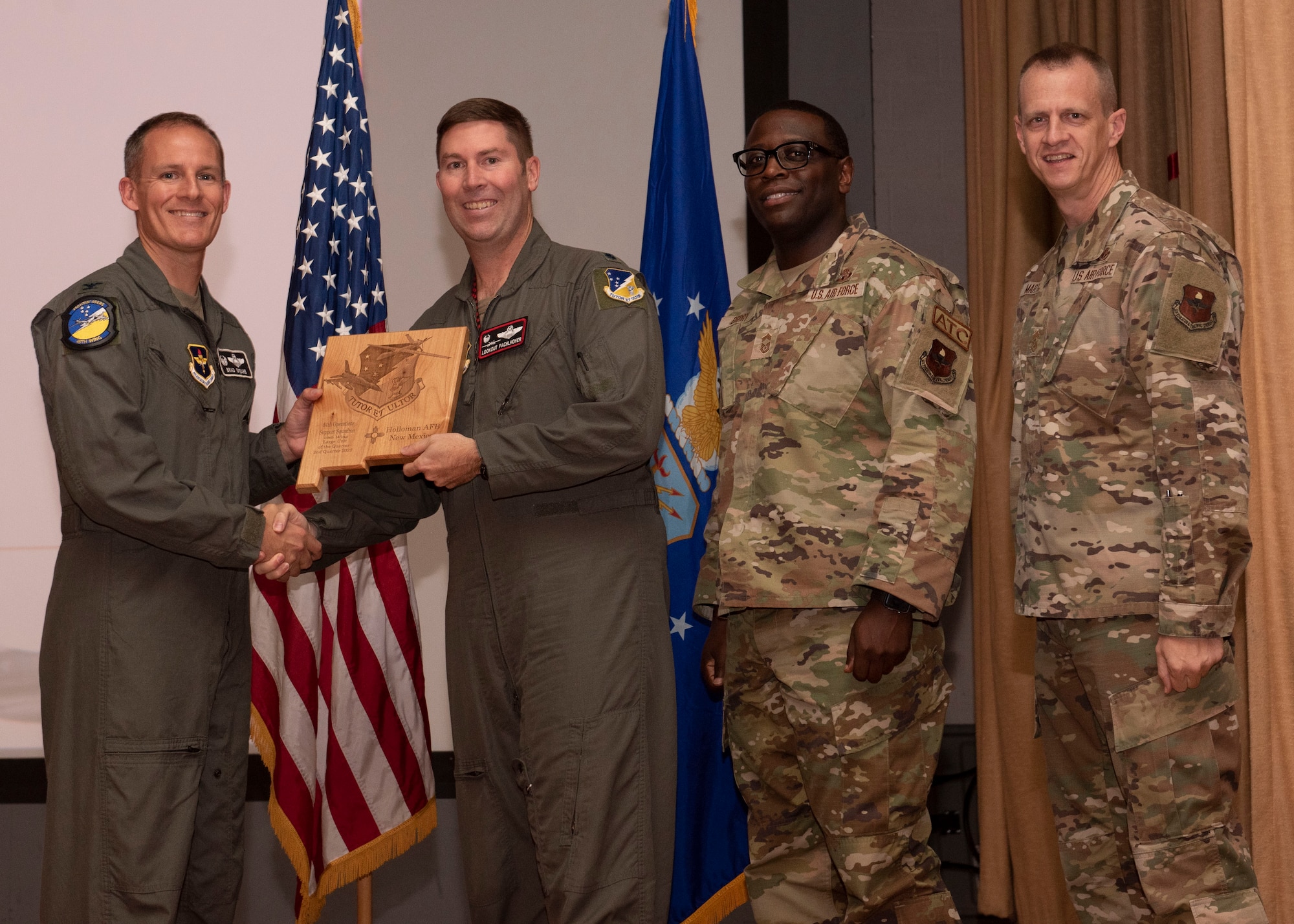 Representatives from the 49th Component Maintenance Squadron accept the small unit of the quarter award during the 49th Wing’s 2nd quarter award ceremony, Aug. 29, 2022, at Holloman Air Force Base, New Mexico. Quarterly award winners were selected based on their technical expertise, demonstration of leadership and job performance. (U.S. Air Force photo by Airman 1st Class Nicholas Paczkowski)