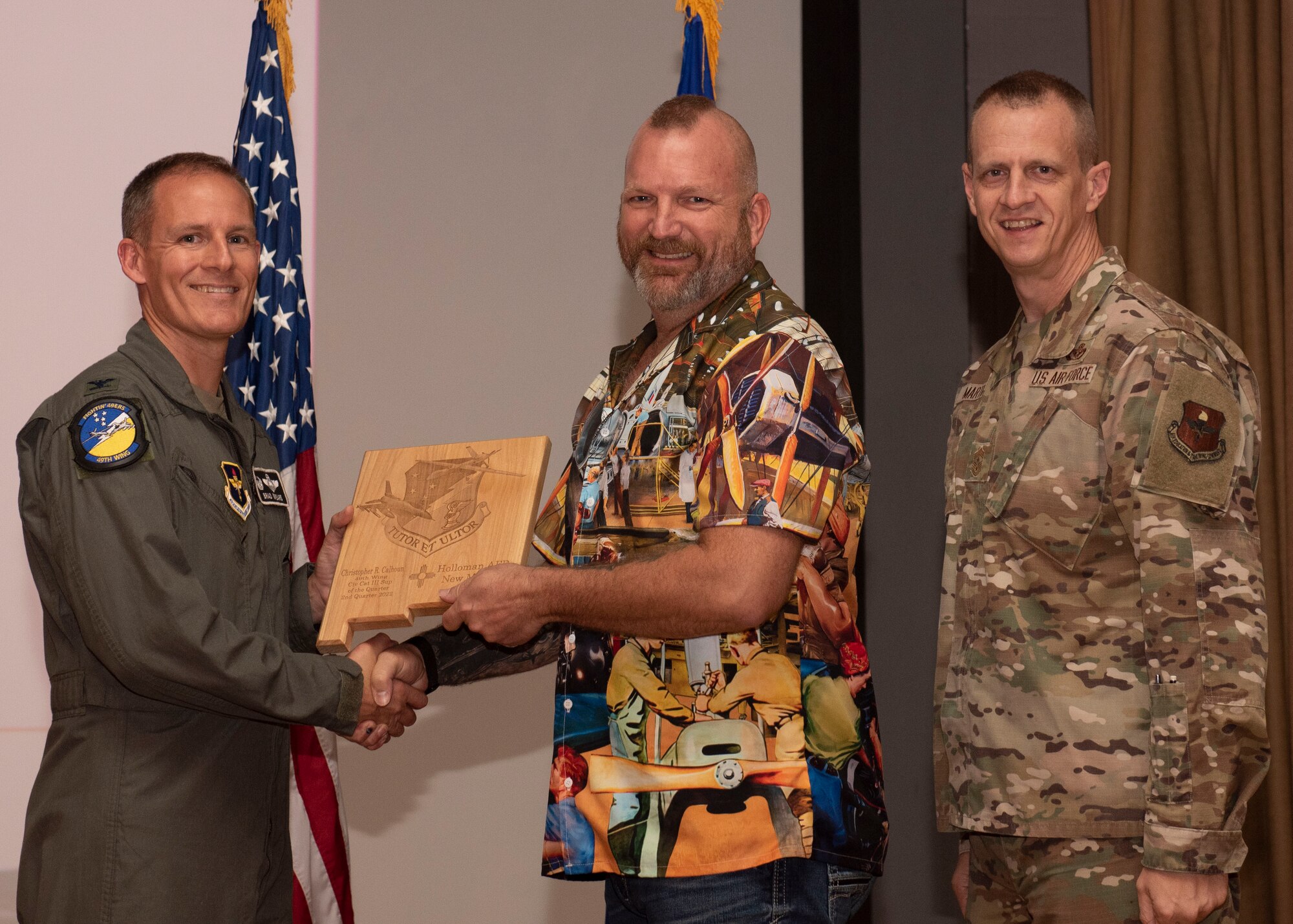 Christopher Calhoun, from the 49th Component Maintenance Squadron, accepts the Civilian Category III (Supervisory) of the Quarter award during the 49th Wing’s 2nd quarter award ceremony, Aug. 29, 2022, at Holloman Air Force Base, New Mexico. Quarterly award winners were selected based on their technical expertise, demonstration of leadership and job performance. (U.S. Air Force photo by Airman 1st Class Nicholas Paczkowski)