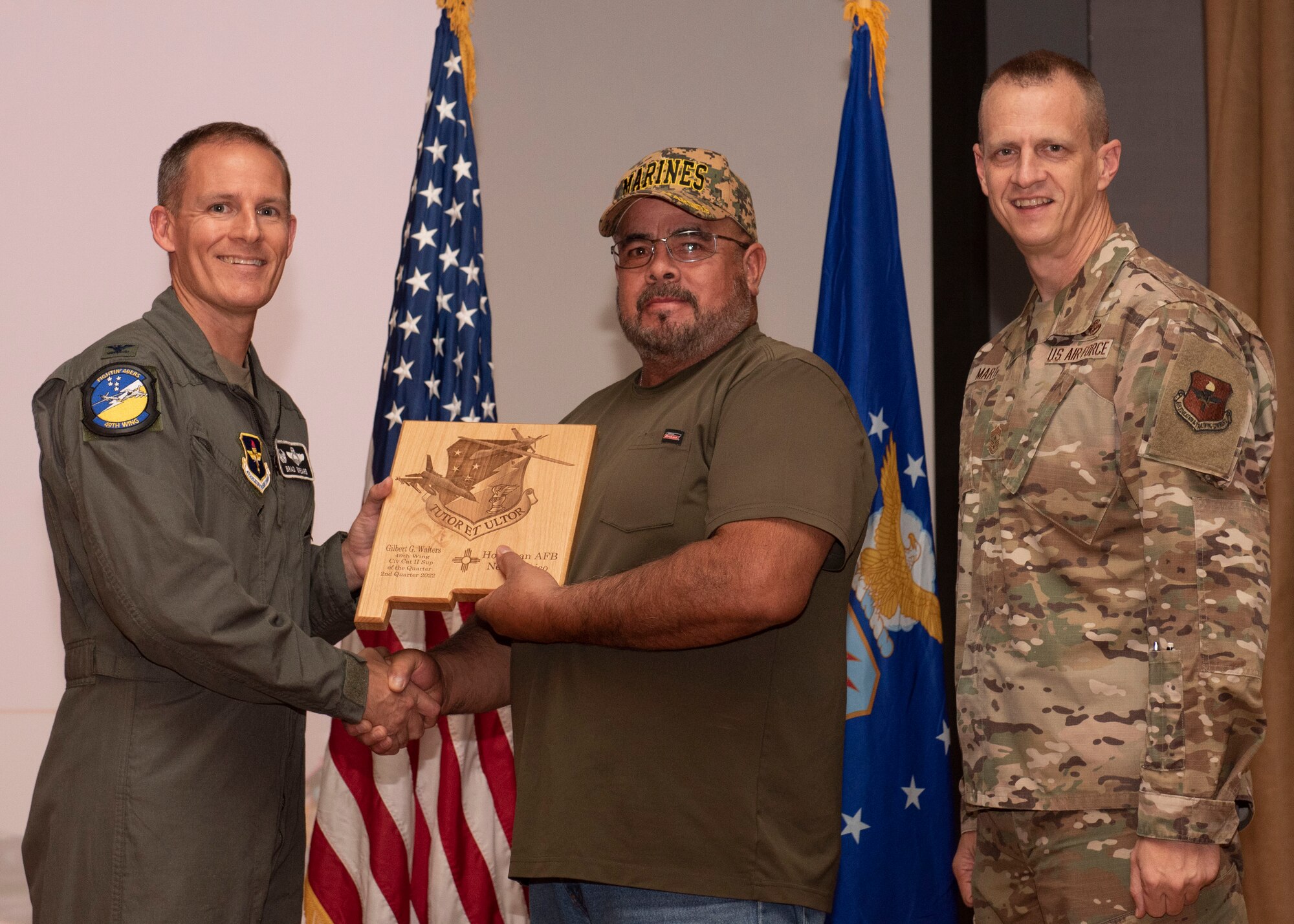 Kolie Chang, from the 8th Fighter Squadron, accepts the Civilian Category II (Non-supervisory) of the Quarter award during the 49th Wing’s 2nd quarter award ceremony, Aug. 29, 2022, at Holloman Air Force Base, New Mexico. Quarterly award winners were selected based on their technical expertise, demonstration of leadership and job performance. (U.S. Air Force photo by Airman 1st Class Nicholas Paczkowski)