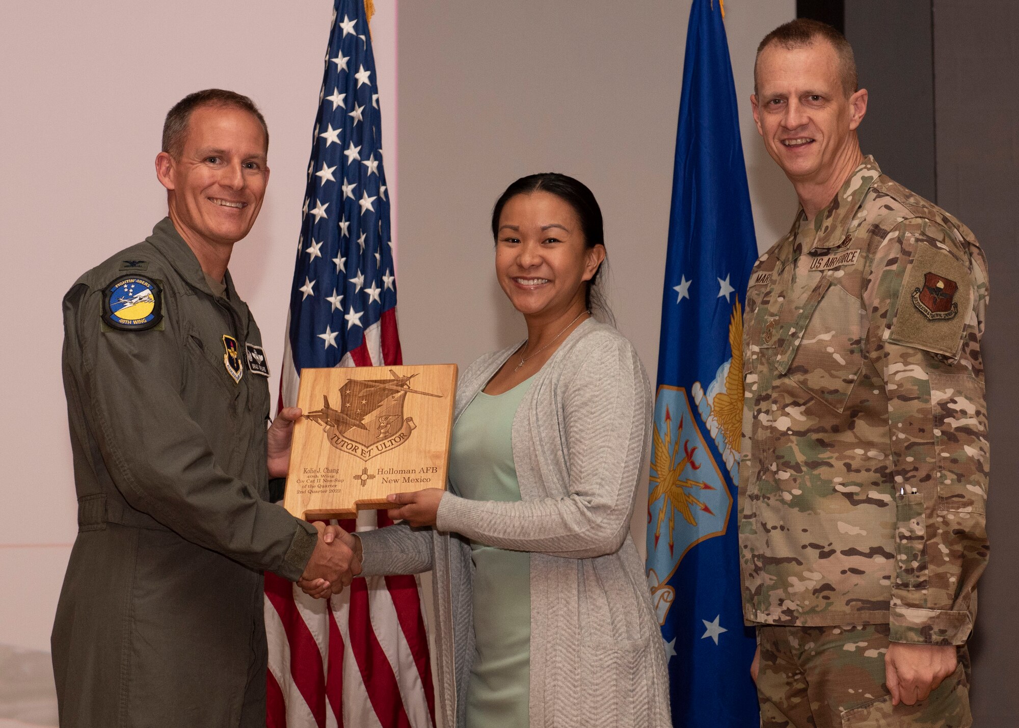 Kolie Chang, from the 8th Fighter Squadron, accepts the Civilian Category II (Non-supervisory) of the Quarter award during the 49th Wing’s 2nd quarter award ceremony, Aug. 29, 2022, at Holloman Air Force Base, New Mexico. Quarterly award winners were selected based on their technical expertise, demonstration of leadership and job performance. (U.S. Air Force photo by Airman 1st Class Nicholas Paczkowski)