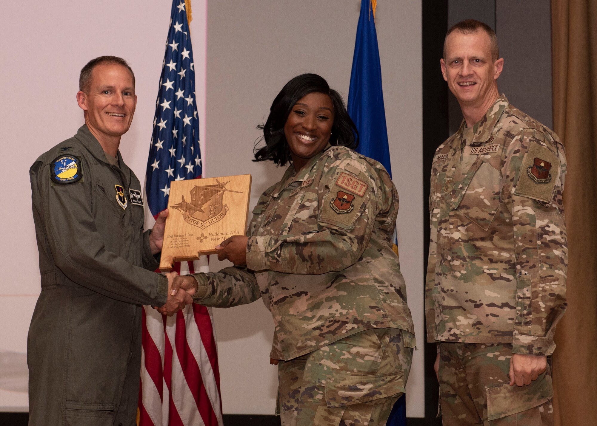 U.S. Air Force Master Sgt. Tiawanna Dunn, from the 49th Equipment Maintenance Squadron, accepts the First Sergeant of the Quarter award during the 49th Wing’s 2nd quarter award ceremony, Aug. 29, 2022, at Holloman Air Force Base, New Mexico. Quarterly award winners were selected based on their technical expertise, demonstration of leadership and job performance. (U.S. Air Force photo by Airman 1st Class Nicholas Paczkowski)